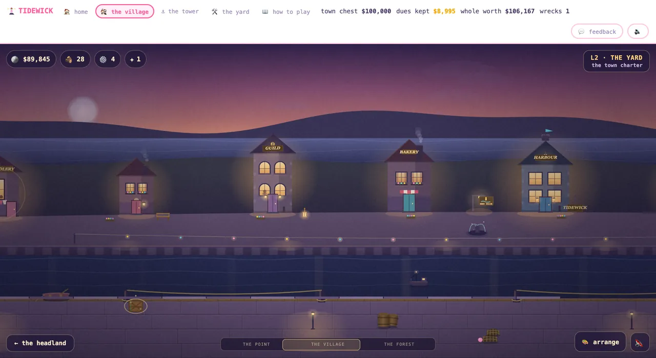 The village at dusk with the guild, bakery and harbour buildings lit